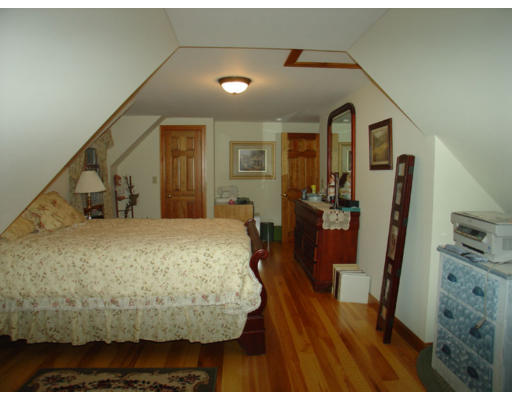 129 Walnut Hill Road Orange, MA 01364 - Photo 13 of 23 a bedroom with a bed and a view of bathroom