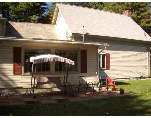 129 Walnut Hill Road Orange, MA 01364 - Photo 16 of 23 a view of a two chairs and table in the patio