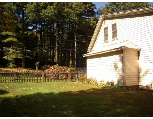 129 Walnut Hill Road Orange, MA 01364 - Photo 18 of 23 a view of an house with backyard space and garden