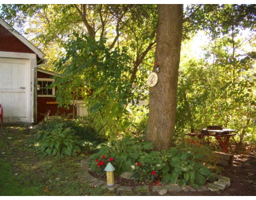 129 Walnut Hill Road Orange, MA 01364 - Photo 20 of 23 a backyard of a house with lots of green space