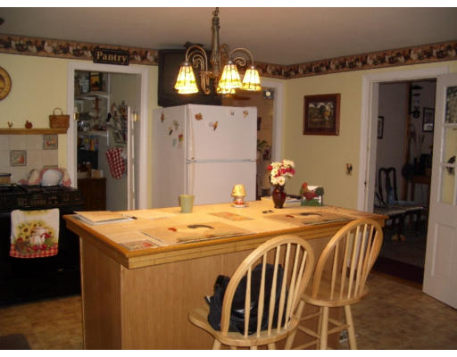 129 Walnut Hill Road Orange, MA 01364 - Photo 2 of 23 a dining room with a table and chairs