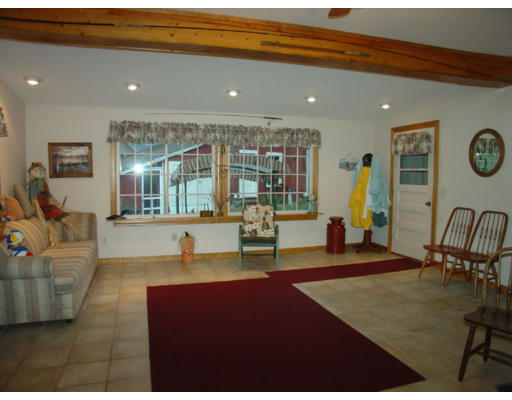 129 Walnut Hill Road Orange, MA 01364 - Photo 10 of 23 a living room with furniture and wooden floor