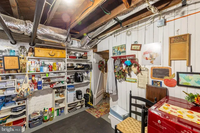 a bathroom with a toilet a sink and a mirror