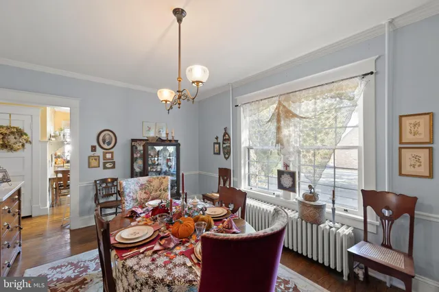 a living room with fireplace furniture and a large window