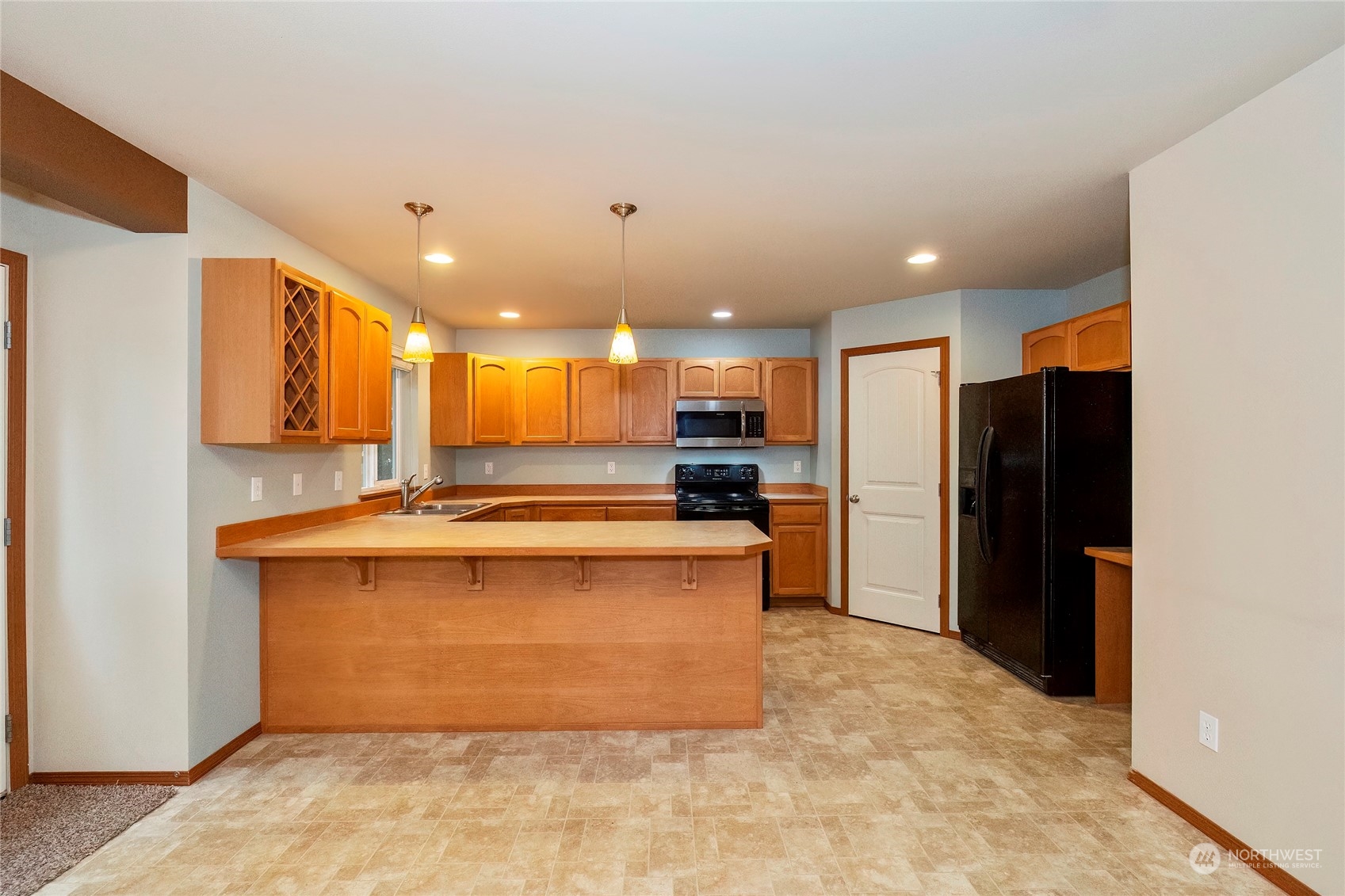 166 Gazebo Street Port Orchard, WA 98366 - Photo 11 of 22 a kitchen with stainless steel appliances granite countertop a refrigerator a stove and a sink