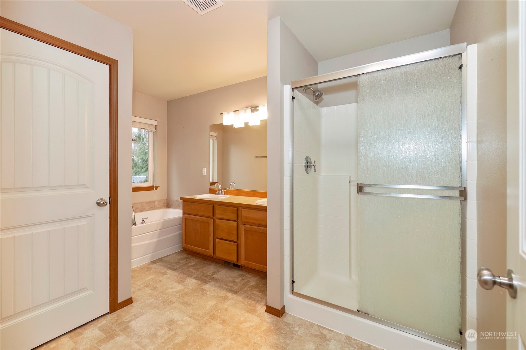 166 Gazebo Street Port Orchard, WA 98366 - Photo 15 of 22 a bathroom with a granite countertop sink mirror and a bathtub