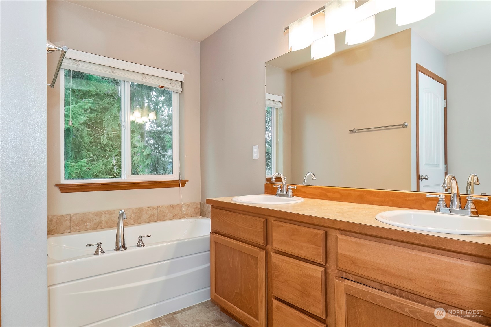 166 Gazebo Street Port Orchard, WA 98366 - Photo 16 of 22 a bathroom with a sink and a bathtub