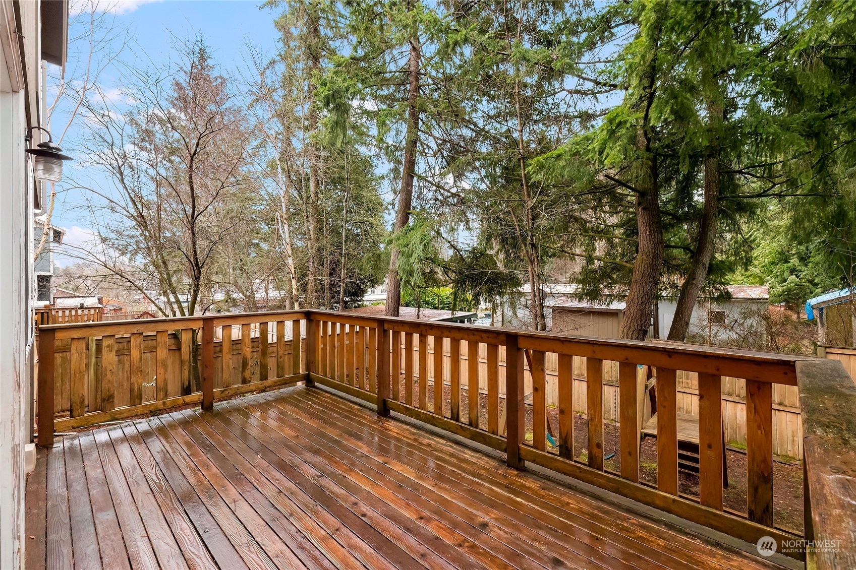 166 Gazebo Street Port Orchard, WA 98366 - Photo 20 of 22 a balcony with wooden floor and fence