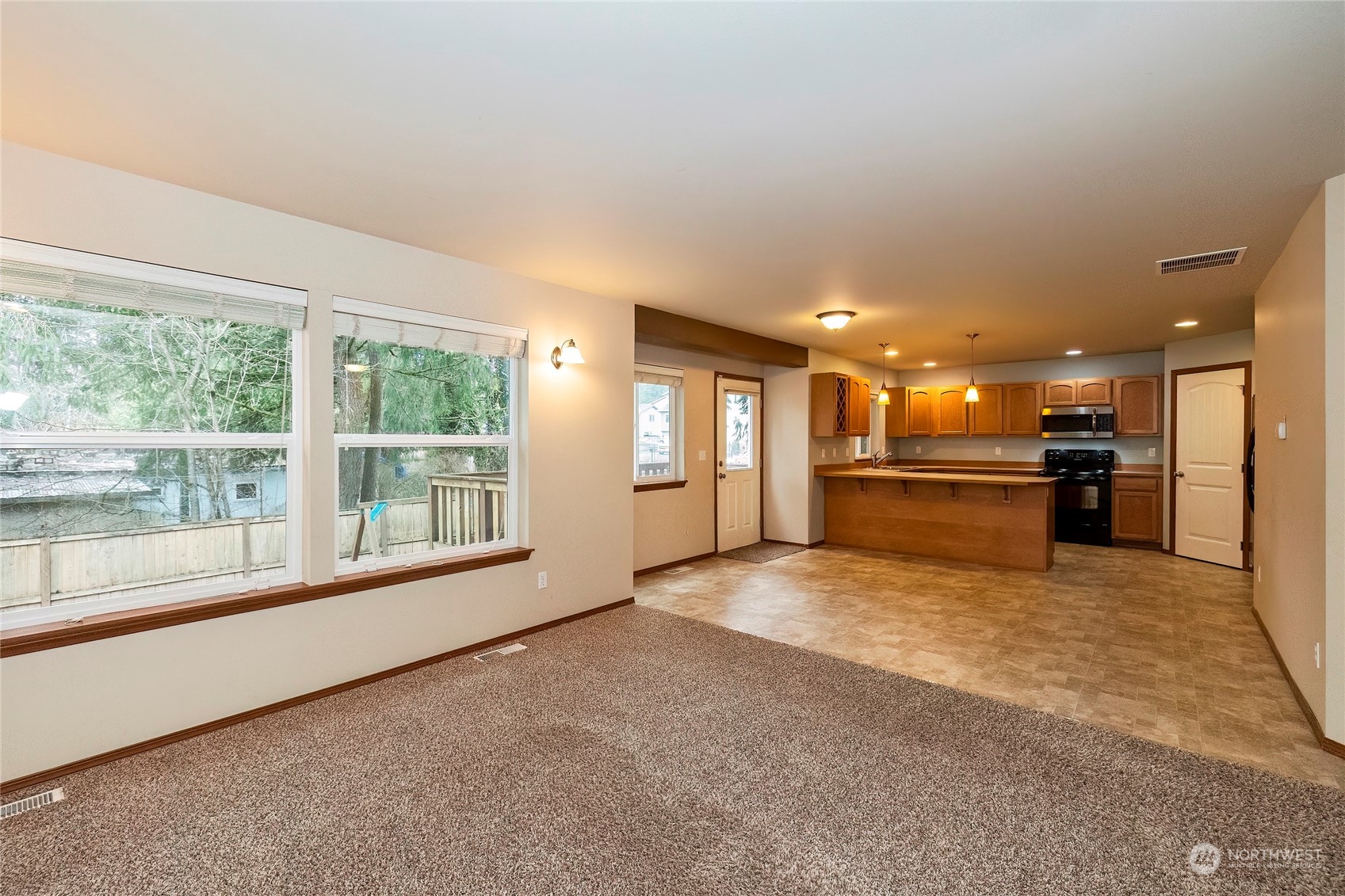 166 Gazebo Street Port Orchard, WA 98366 - Photo 6 of 22 a view of an empty room with a kitchen stove back oven
