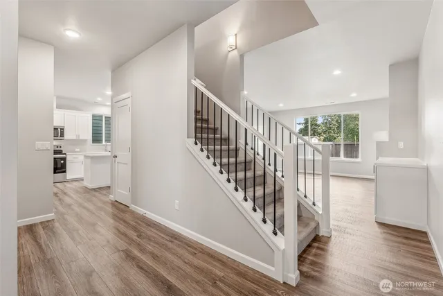 a view of entryway with wooden floor