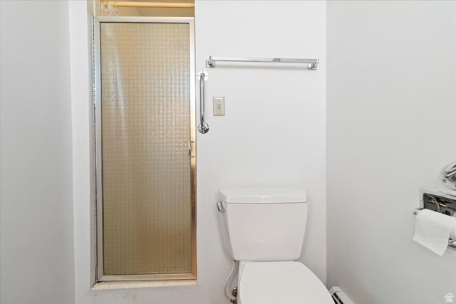 217 East 400 South Spring City, UT 84662 - Photo 22 of 71 Bathroom with a shower stall and a baseboard heating unit