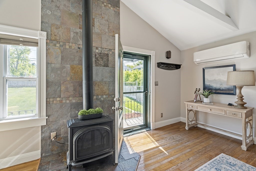 645 Nashua Road Dracut, MA 01826 - Photo 15 of 30 a living room with a balcony a bed furniture and a window