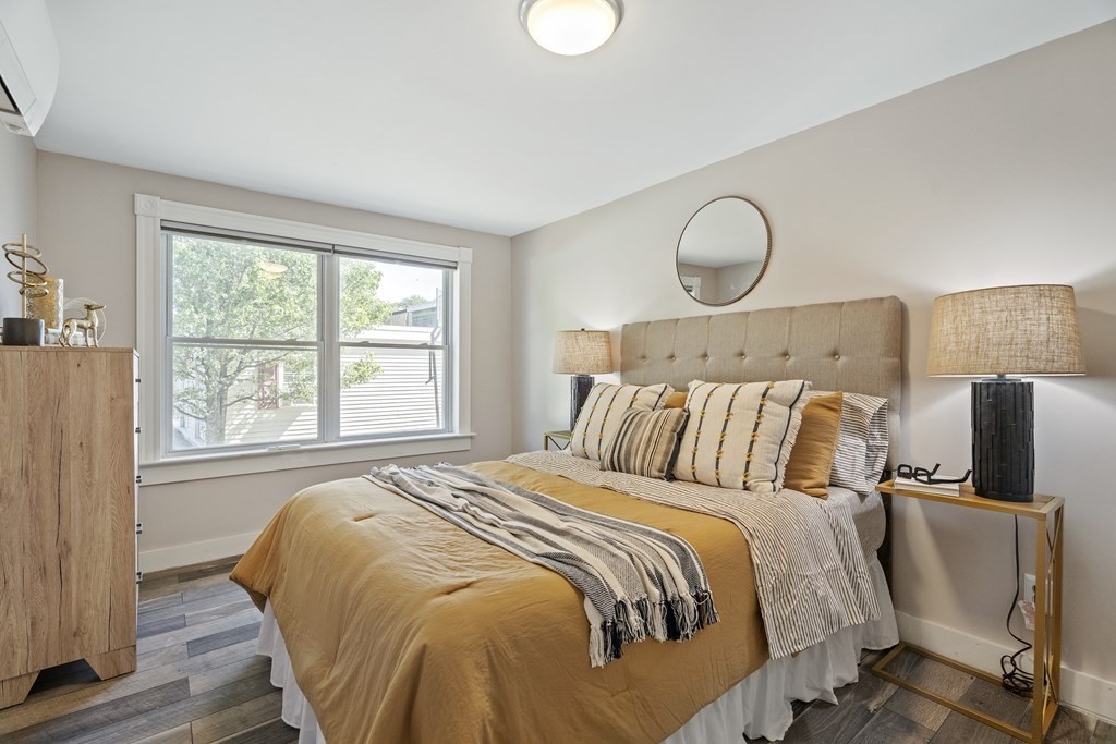 645 Nashua Road Dracut, MA 01826 - Photo 18 of 30 a bed sitting in a bedroom next to a window