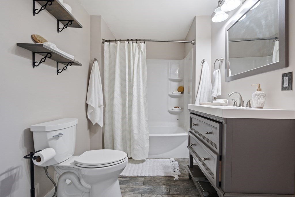 645 Nashua Road Dracut, MA 01826 - Photo 20 of 30 a bathroom with a sink toilet and shower