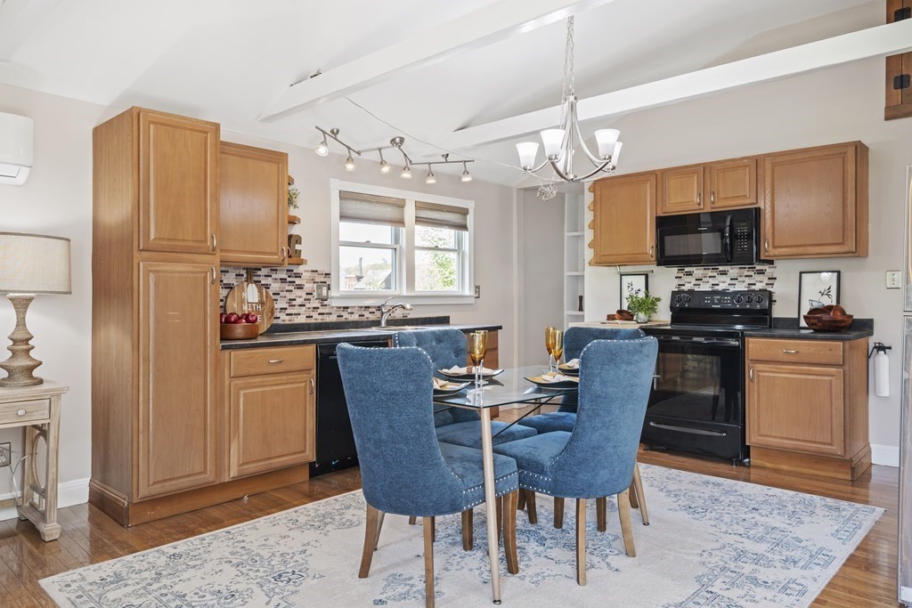 645 Nashua Road Dracut, MA 01826 - Photo 2 of 30 a dining room with furniture a chandelier and wooden floor