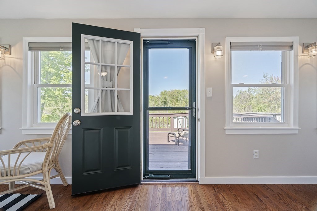 645 Nashua Road Dracut, MA 01826 - Photo 23 of 30 a view of a bedroom with wooden floor and windows