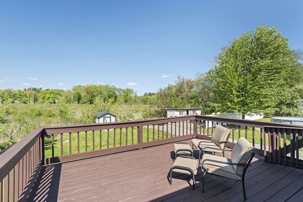 645 Nashua Road Dracut, MA 01826 - Photo 24 of 30 a view of a two chairs in the balcony