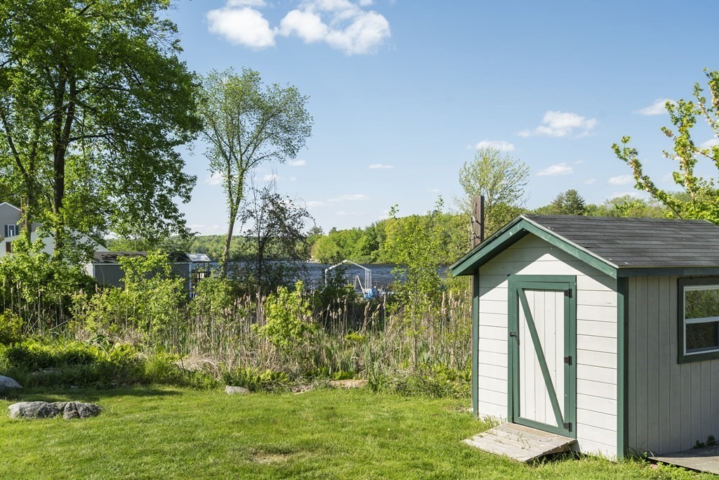 645 Nashua Road Dracut, MA 01826 - Photo 27 of 30 a front view of a house with garden