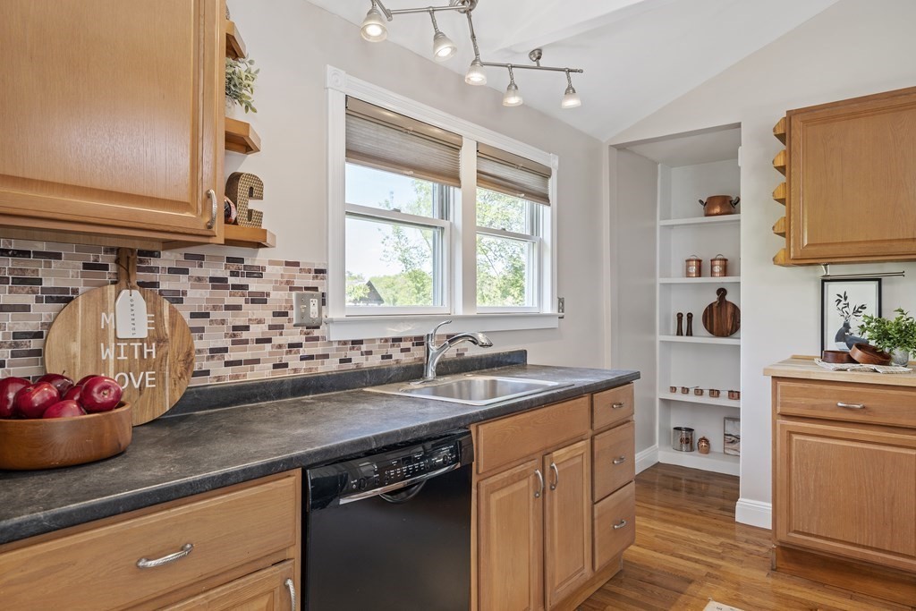 645 Nashua Road Dracut, MA 01826 - Photo 5 of 30 a kitchen with sink stove and cabinets