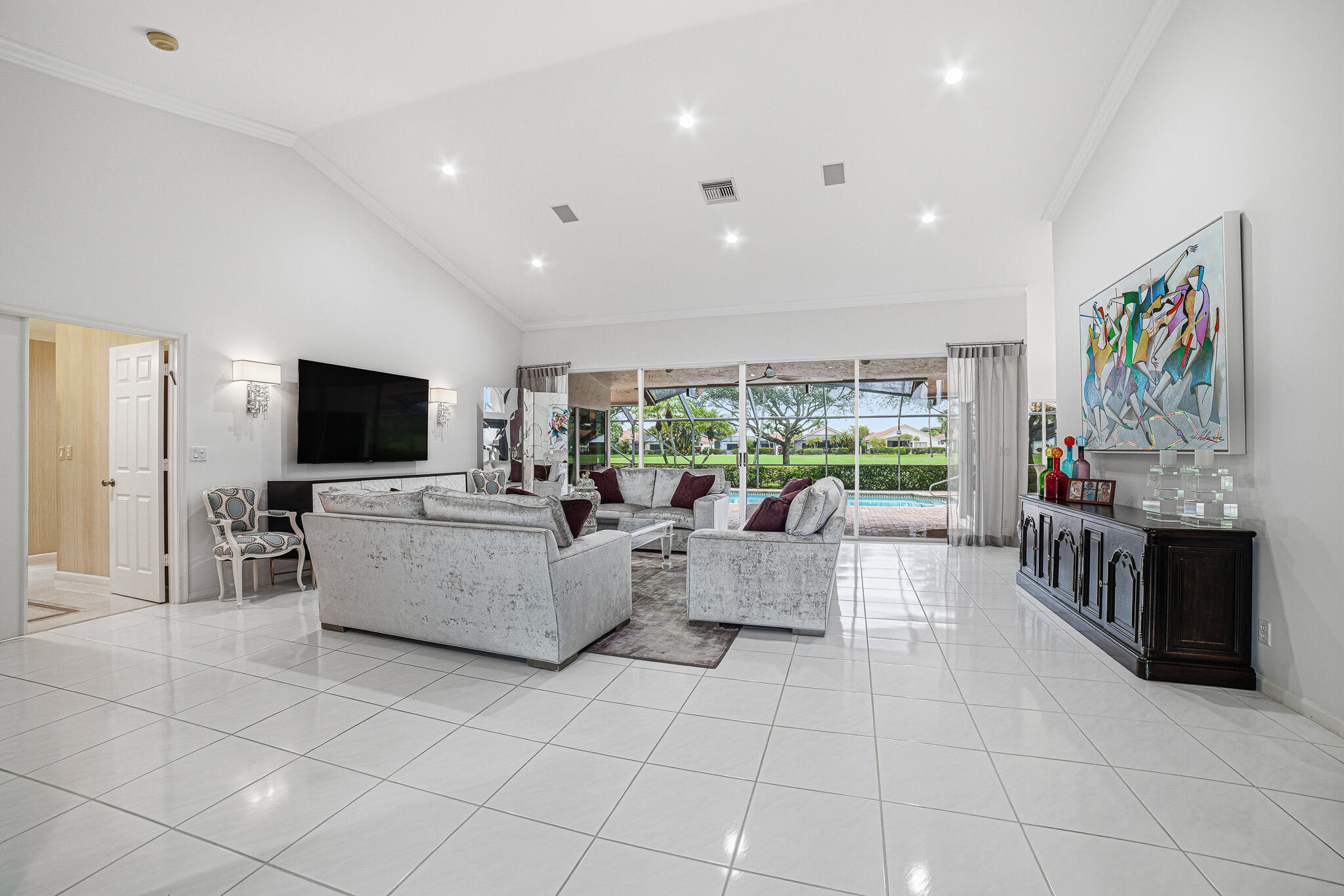 10791 River Glenn Drive Boca Raton, FL 33428 - Photo 11 of 68 a living room with furniture and a flat screen tv