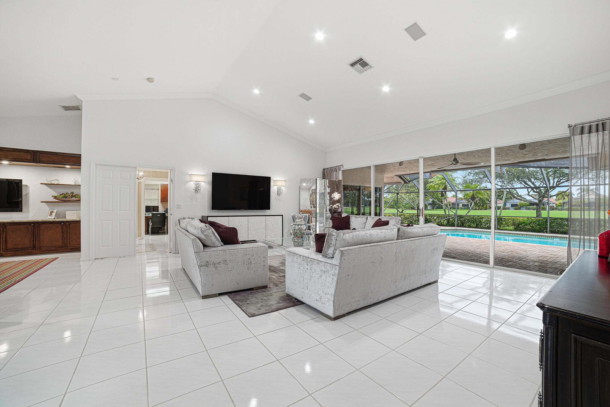 10791 River Glenn Drive Boca Raton, FL 33428 - Photo 13 of 68 a living room with furniture and a flat screen tv