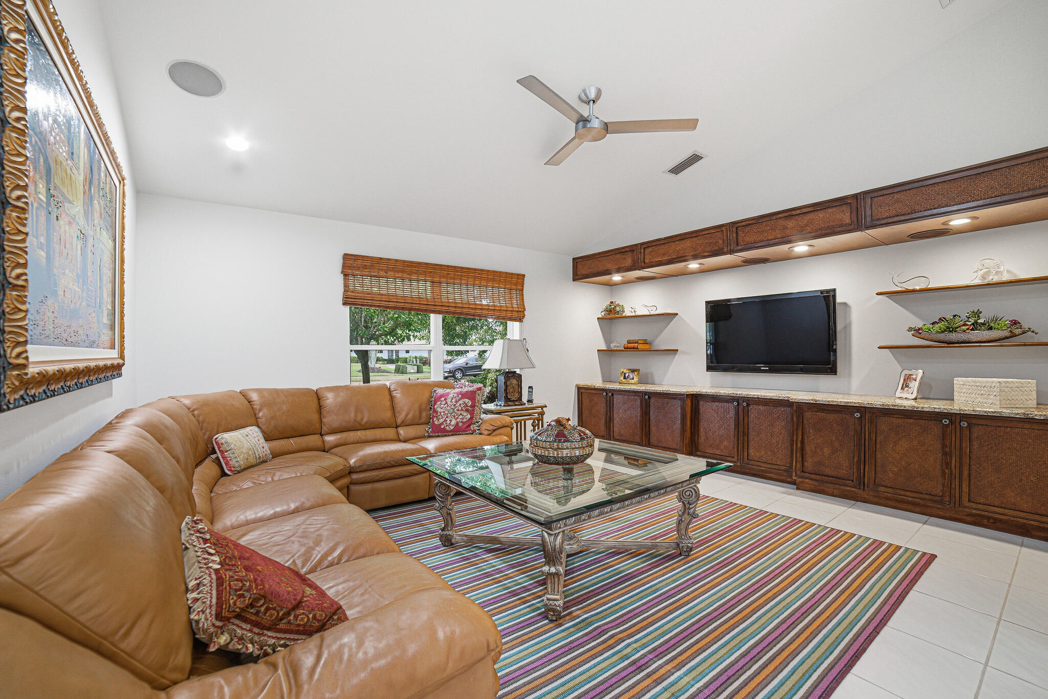 10791 River Glenn Drive Boca Raton, FL 33428 - Photo 15 of 68 a living room with furniture and a flat screen tv