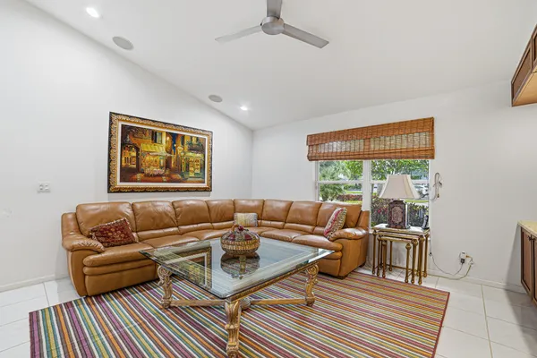 a view of a dining room with furniture wooden floor and chandelier