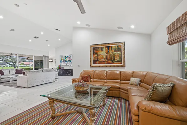 a kitchen with refrigerator a sink and a counter top space