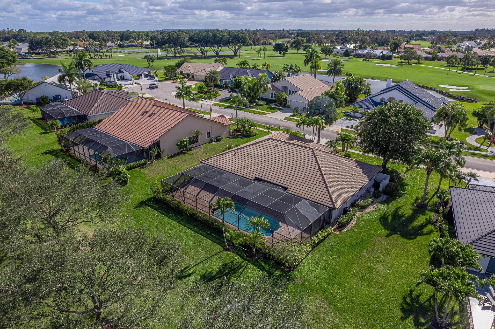 10791 River Glenn Drive Boca Raton, FL 33428 - Photo 2 of 68 an aerial view of a house with a garden and lake view