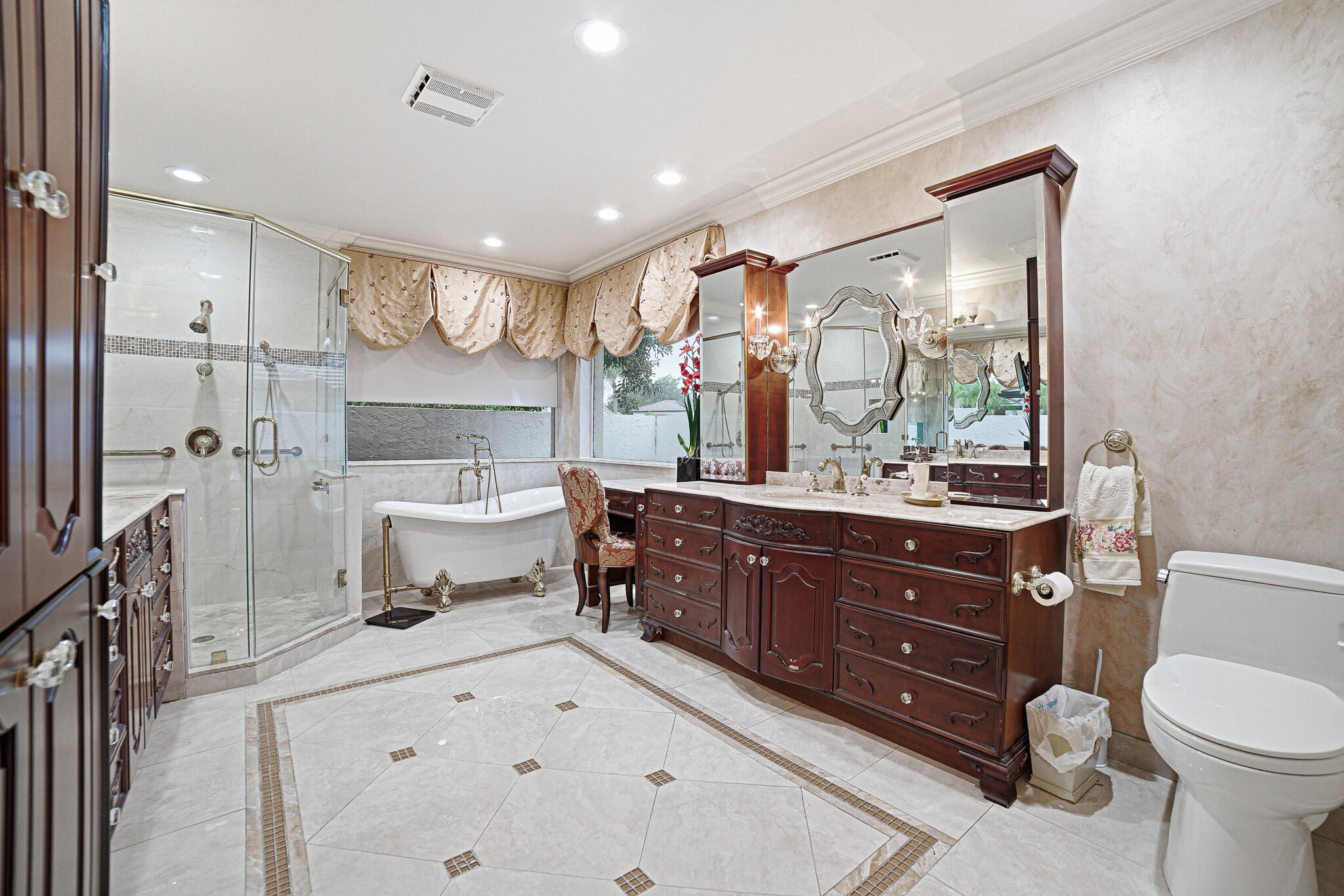 10791 River Glenn Drive Boca Raton, FL 33428 - Photo 31 of 68 a spacious bathroom with a sink mirror vanity and toilet