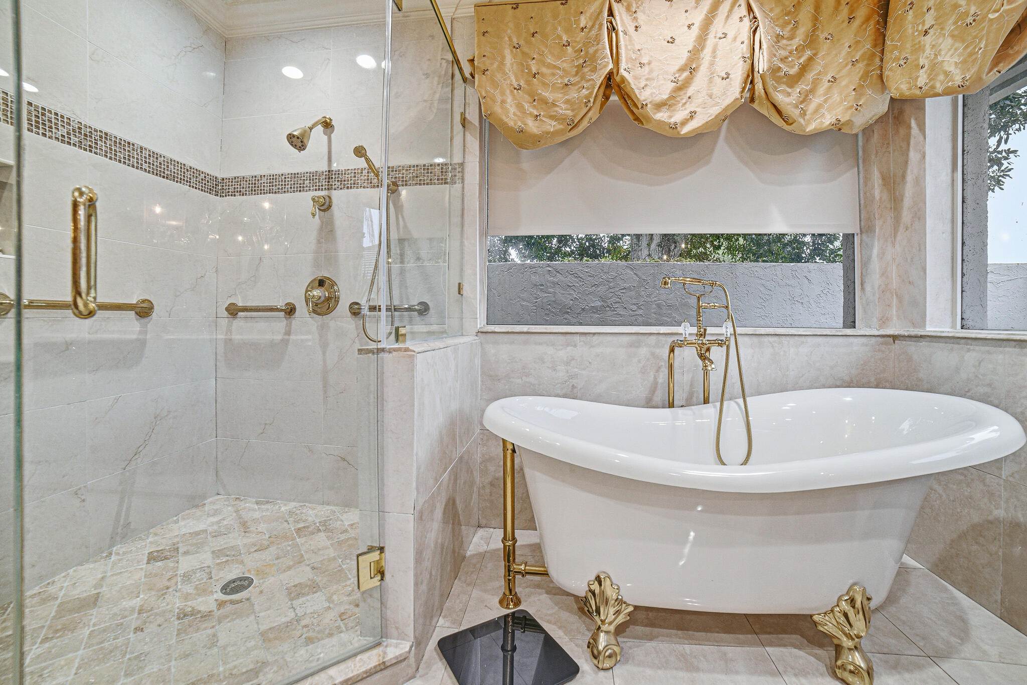 10791 River Glenn Drive Boca Raton, FL 33428 - Photo 33 of 68 a bathroom with a sink a mirror a bathtub and shower