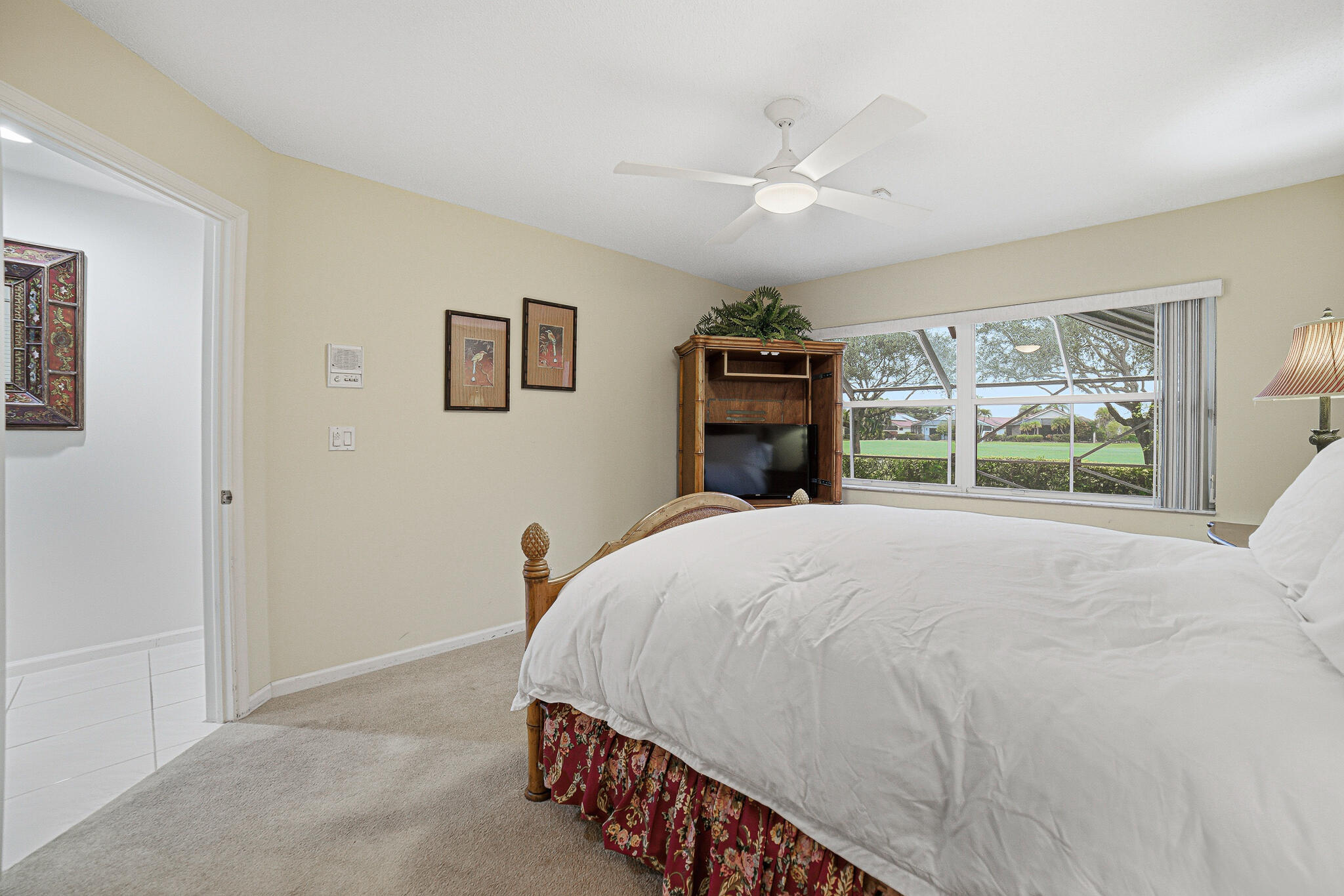 10791 River Glenn Drive Boca Raton, FL 33428 - Photo 36 of 68 a bedroom with a bed and a large window