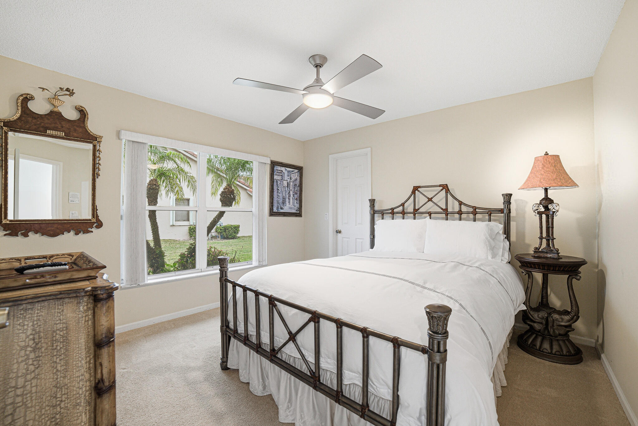 10791 River Glenn Drive Boca Raton, FL 33428 - Photo 37 of 68 a bedroom with a bed and a flat tv screen on dresser