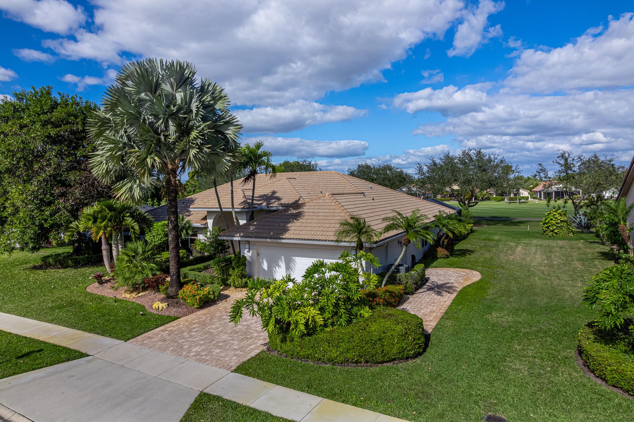 10791 River Glenn Drive Boca Raton, FL 33428 - Photo 46 of 68 a view of a garden with a building in the background