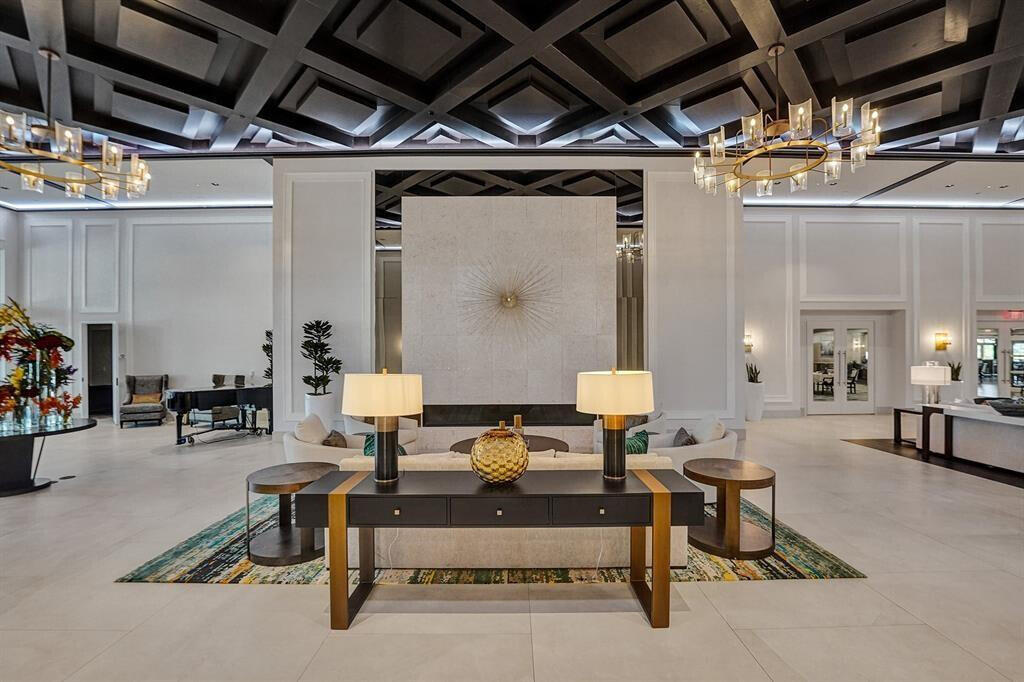 10791 River Glenn Drive Boca Raton, FL 33428 - Photo 52 of 68 a living room with furniture and a chandelier