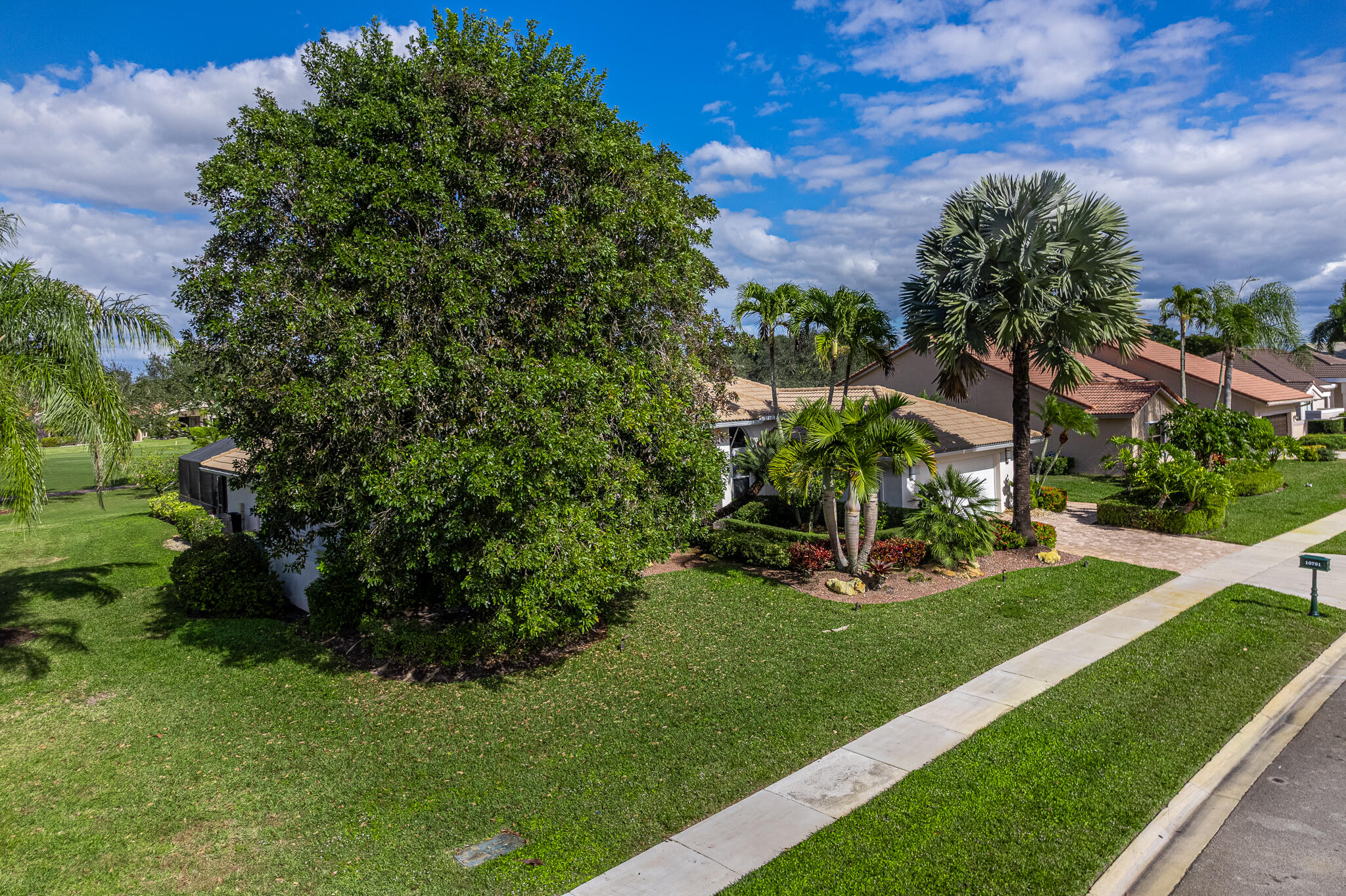 10791 River Glenn Drive Boca Raton, FL 33428 - Photo 65 of 68 a view of a garden with a building in the background