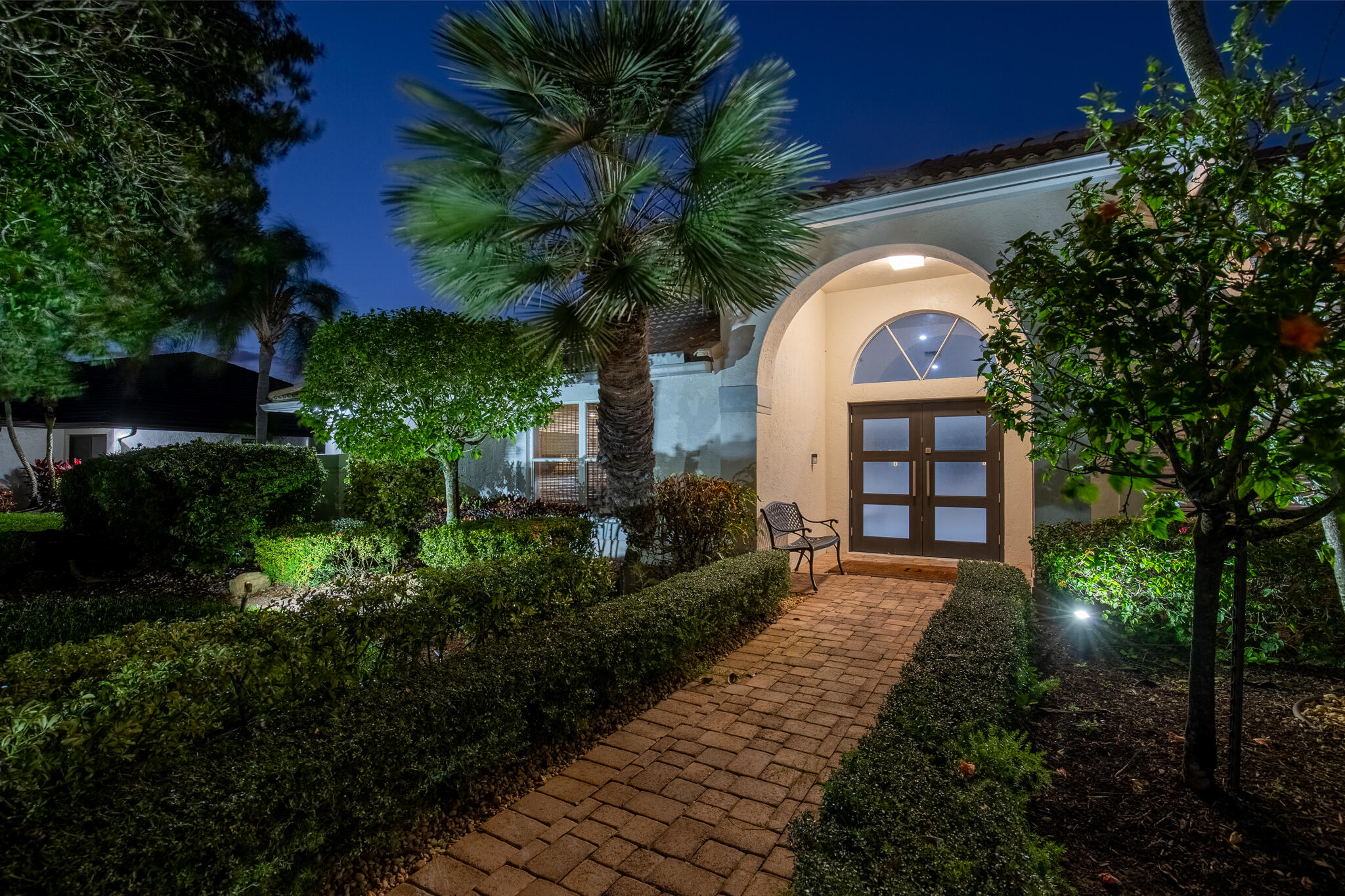 10791 River Glenn Drive Boca Raton, FL 33428 - Photo 7 of 68 a front view of a house with a yard