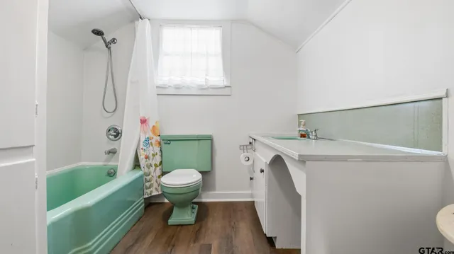 a bathroom with a sink a toilet and a bathtub