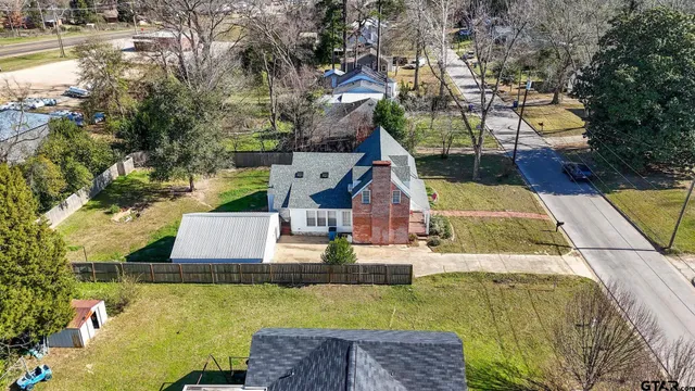a small pool with couple of relaxing chair