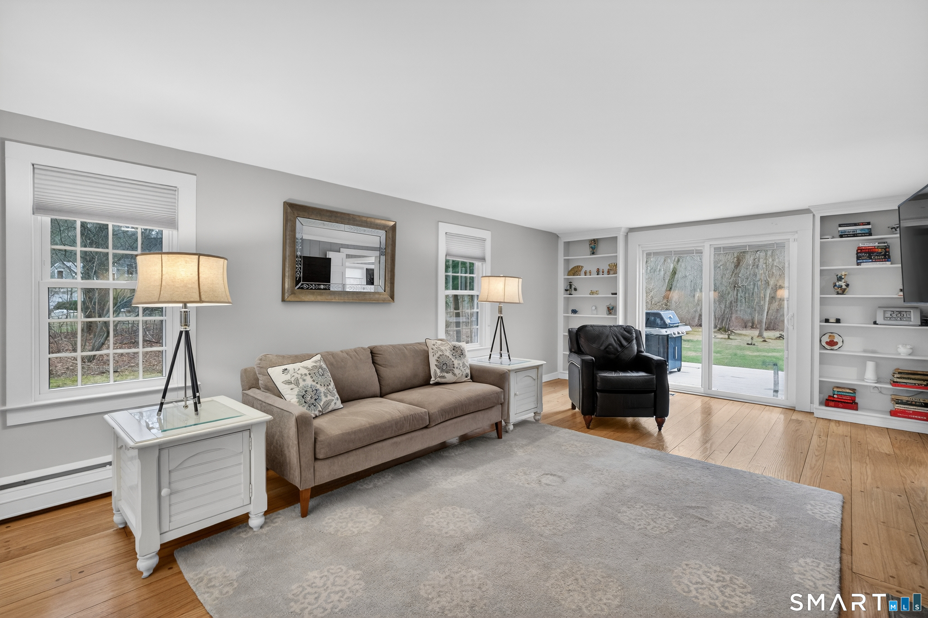 24 Saunders Hollow Road Old Lyme, CT 06371 - Photo 11 of 36 Spacious front back living room with fireplace