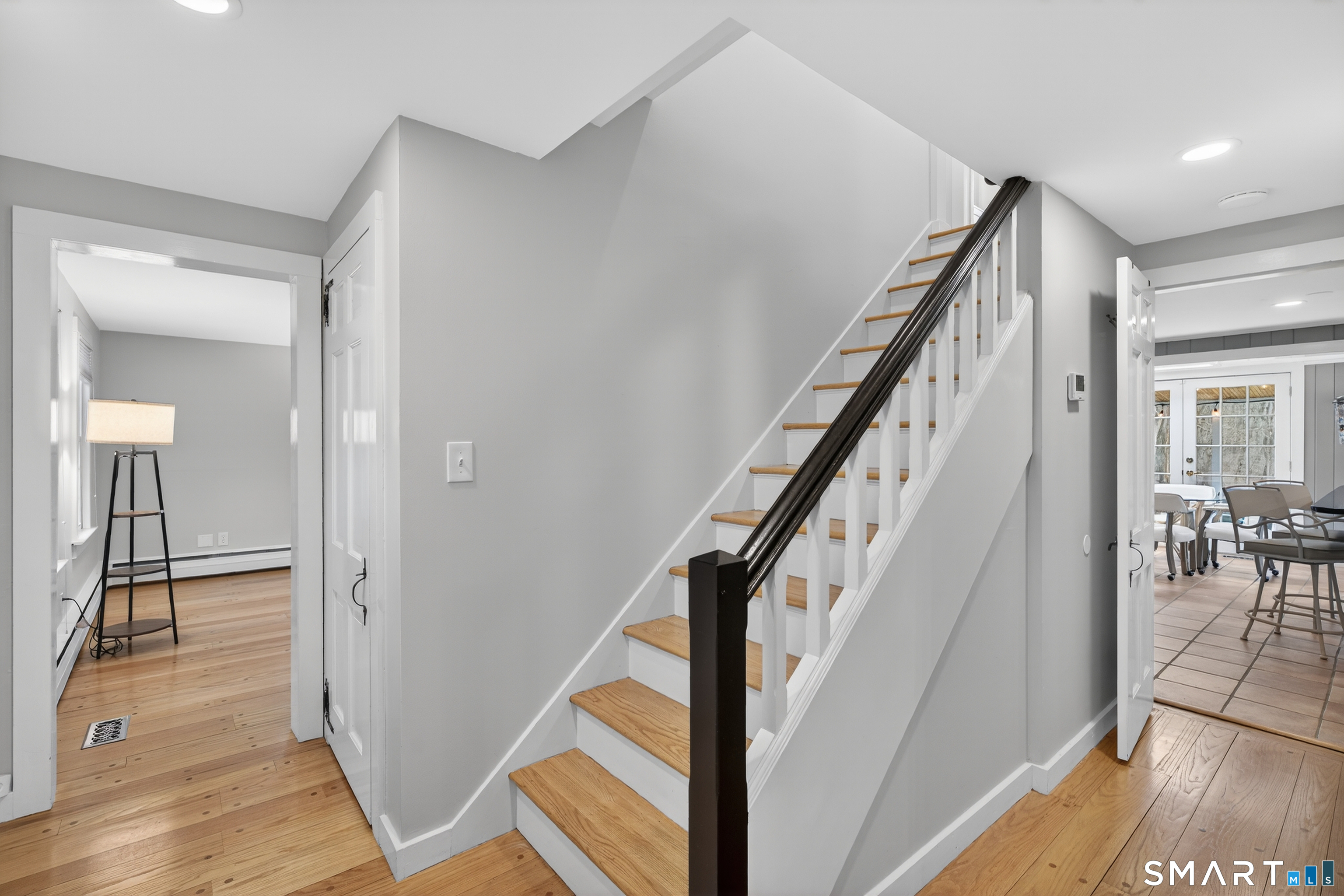 24 Saunders Hollow Road Old Lyme, CT 06371 - Photo 19 of 36 Heading upstairs, the whole home freshly painted, and hardwoods refinished