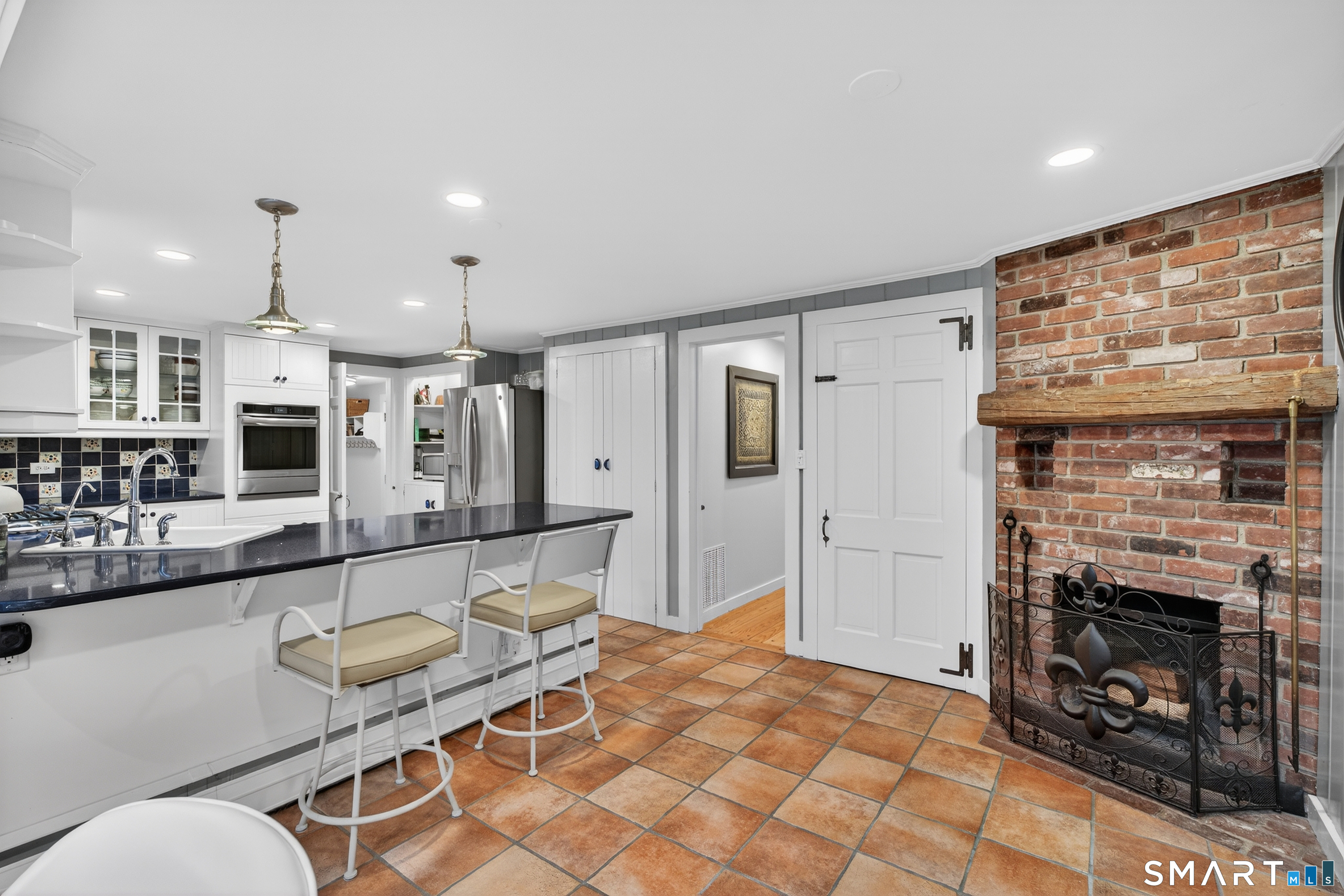 24 Saunders Hollow Road Old Lyme, CT 06371 - Photo 10 of 36 Fireplace in the kitchen