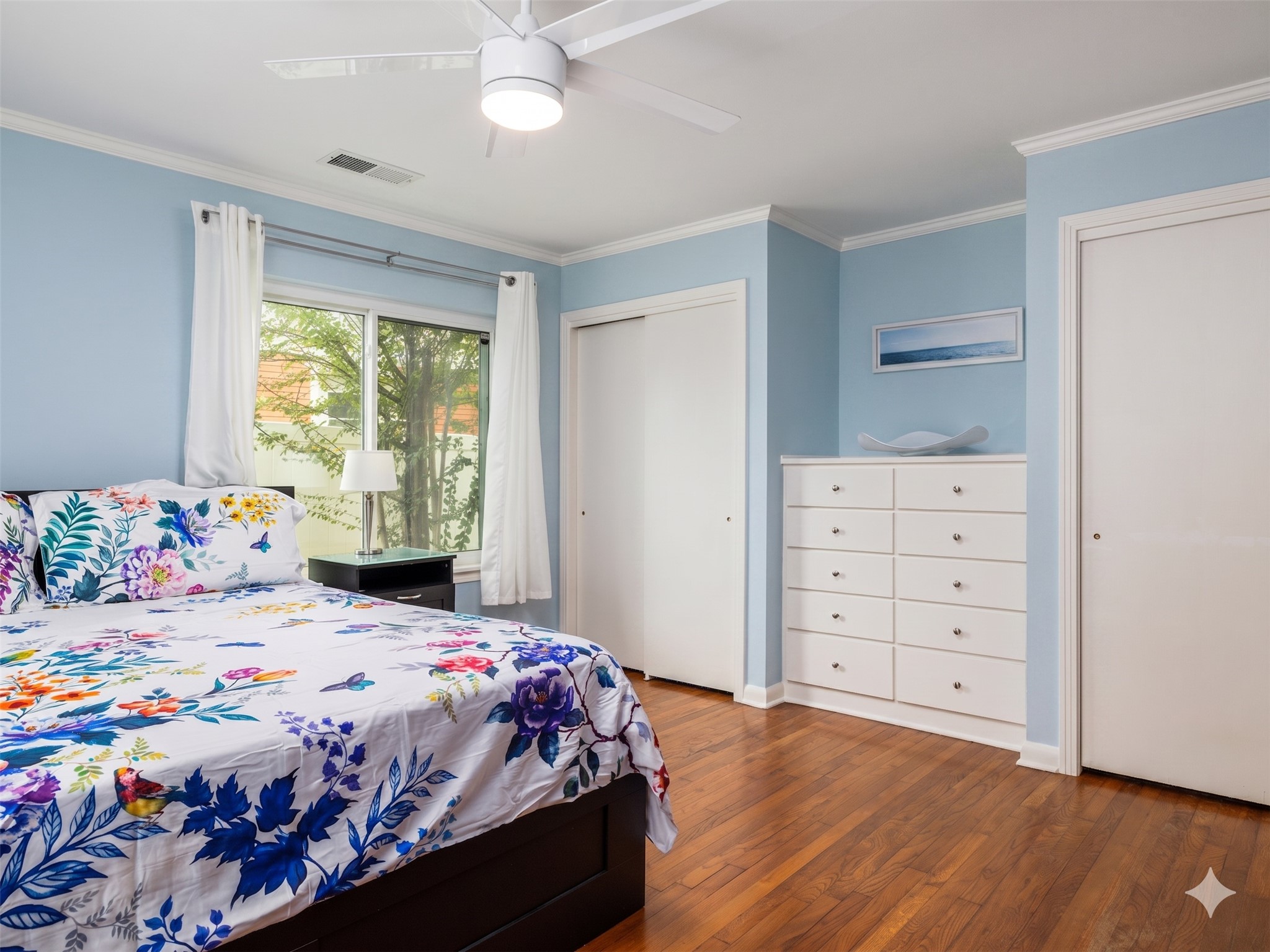 4710 Frontier Trail Austin, TX 78745 - Photo 15 of 32 a bedroom with a bed and a dresser