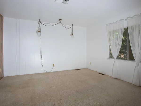 a bathroom with a toilet a sink and a mirror