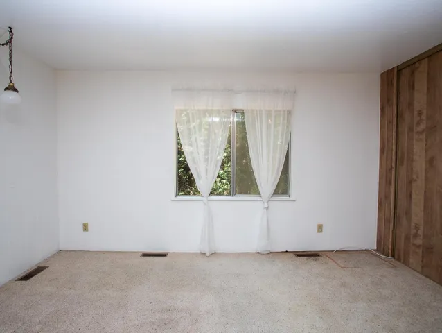 a bathroom with a sink a toilet and shower curtain