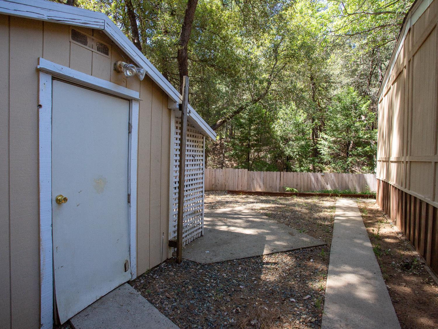 14074 Irish Town Road, Unit 40 Pine Grove, CA 95665 - Photo 38 of 51 a view of a yard with wooden fence and floor