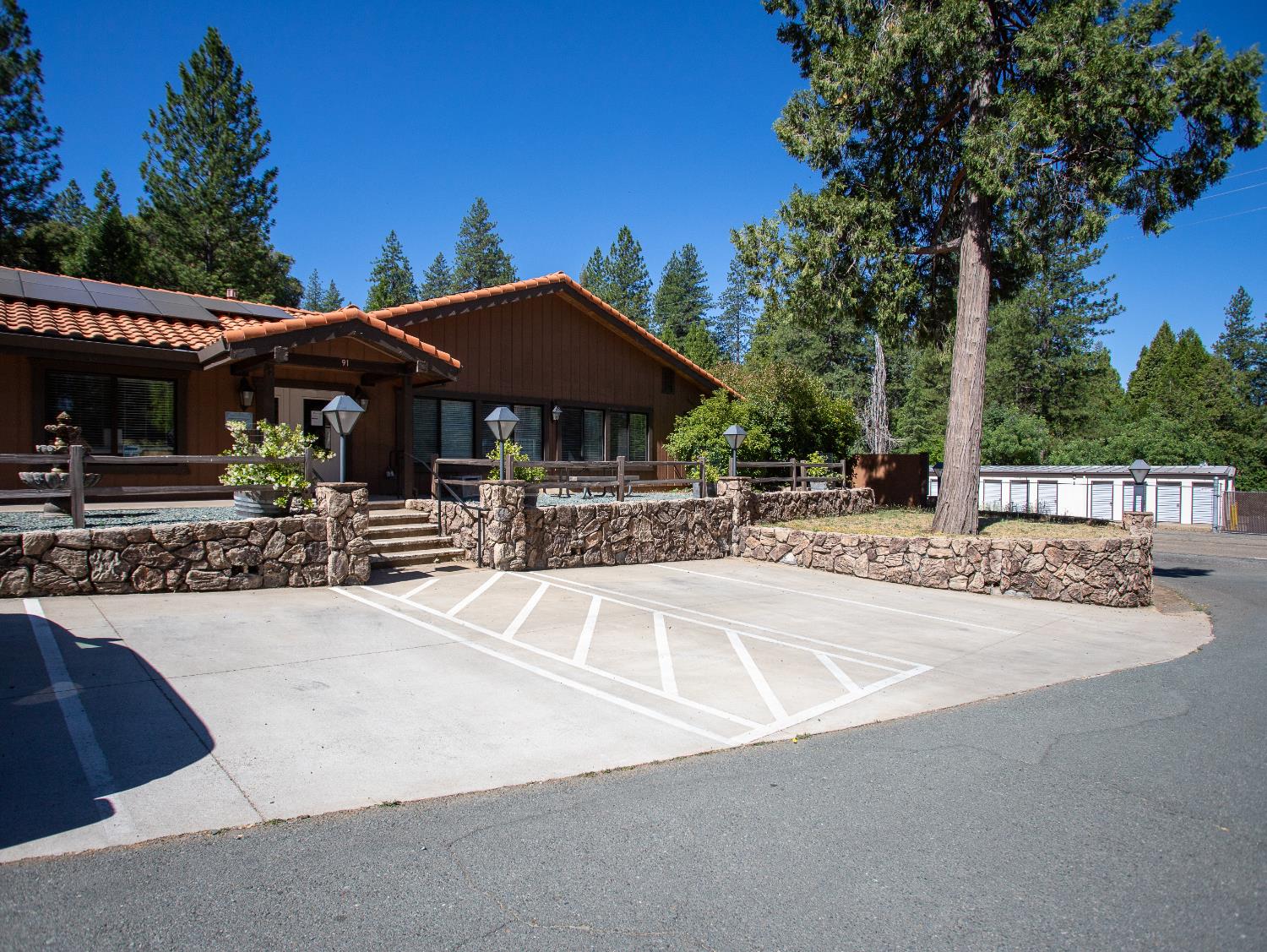 14074 Irish Town Road, Unit 40 Pine Grove, CA 95665 - Photo 43 of 51 a patio with a table and chairs under an umbrella