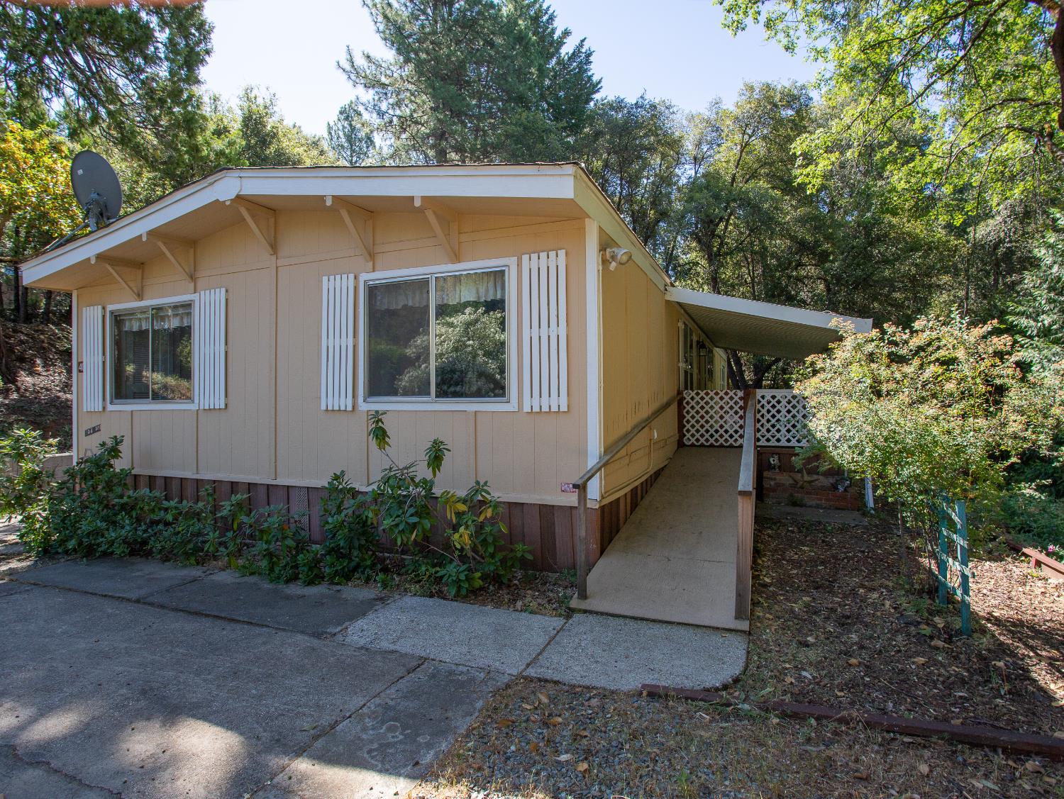 14074 Irish Town Road, Unit 40 Pine Grove, CA 95665 - Photo 5 of 51 a view of a house with a yard