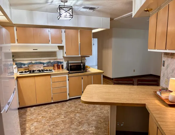 a kitchen with a sink and a window