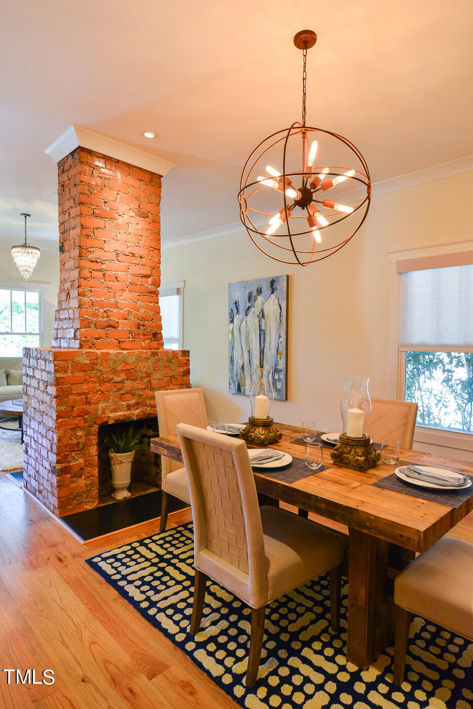 503 Cleveland Street Raleigh, NC 27605 - Photo 12 of 42 a dining room with table chairs and rug